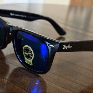 Ray-Ban Glossy Black Sunglasses with Deep Blue Lenses Polarised